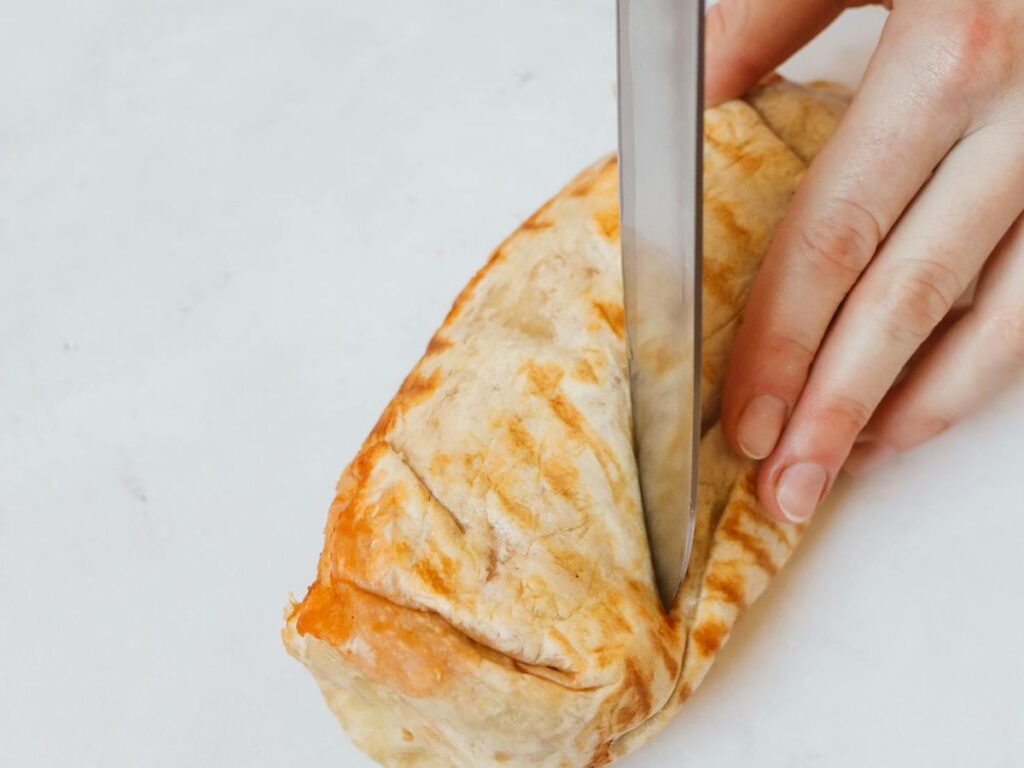 cutting a burrito in half