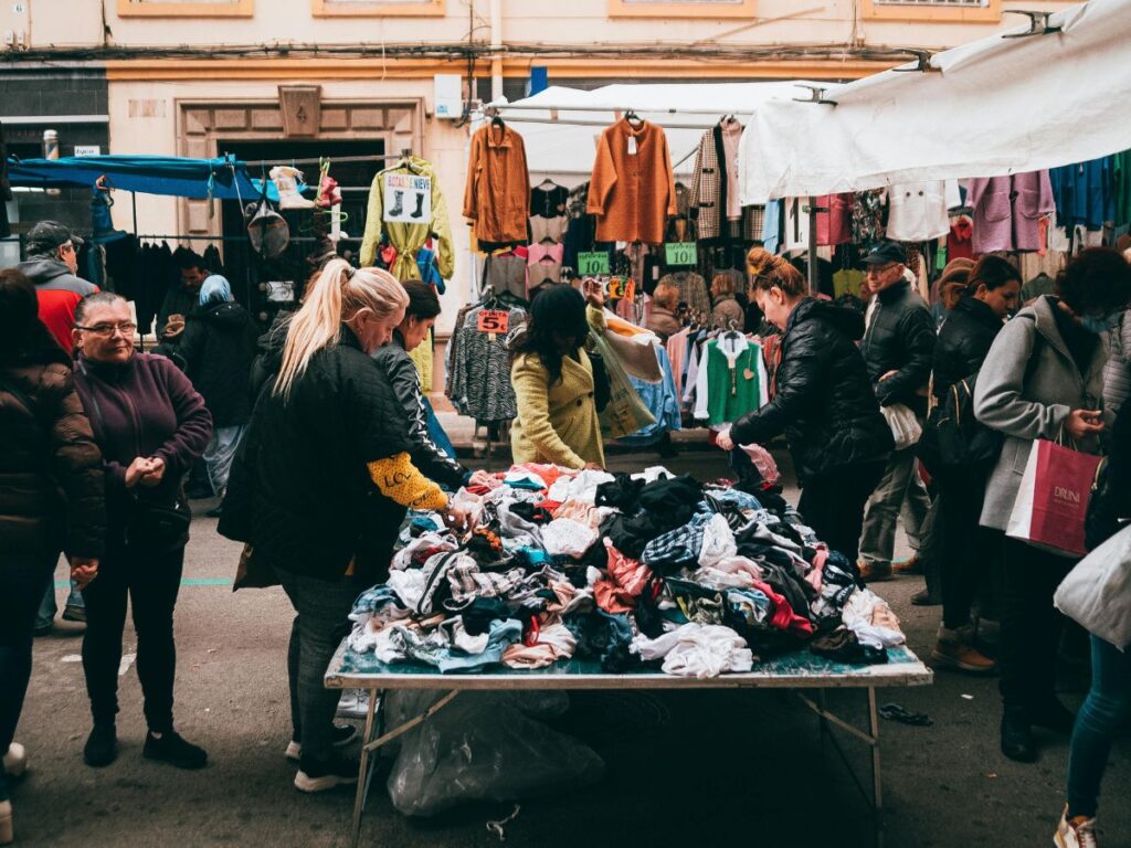 woman finding clothes in a flea market