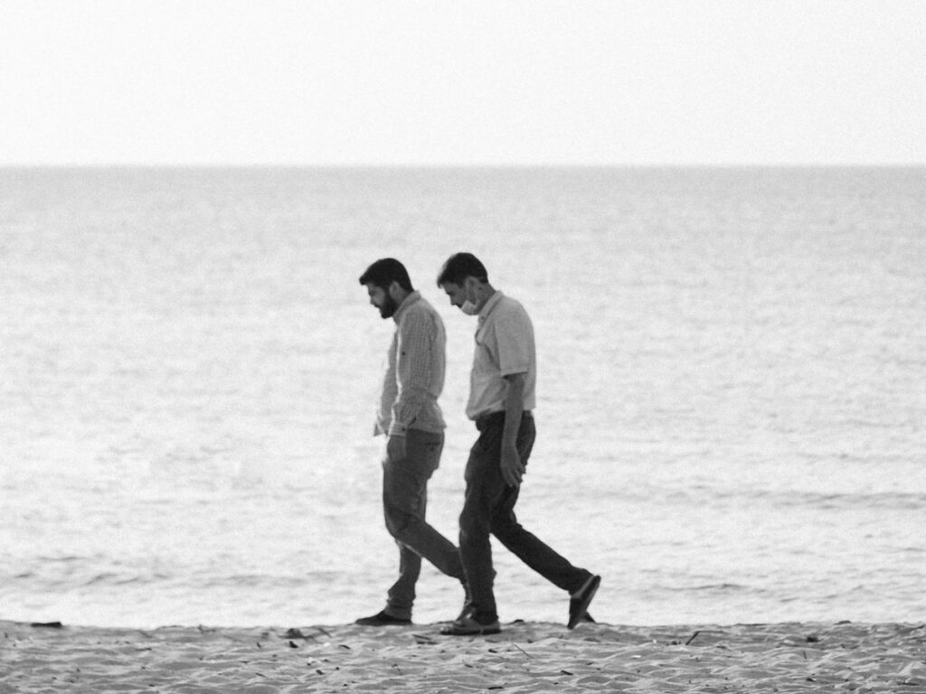 men walking on beach