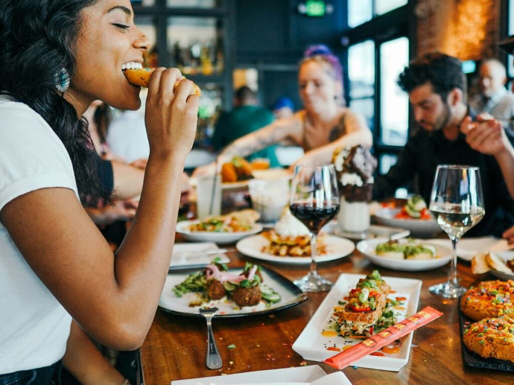 woman eating food in a restaurant