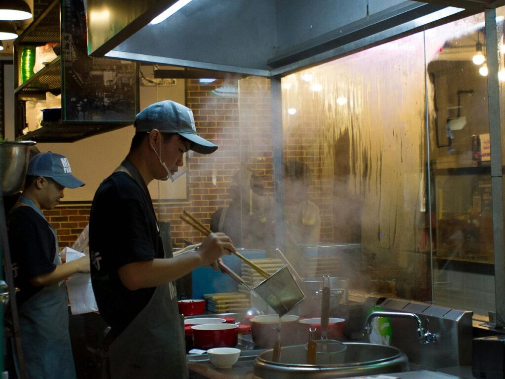 man cooking Chinese food
