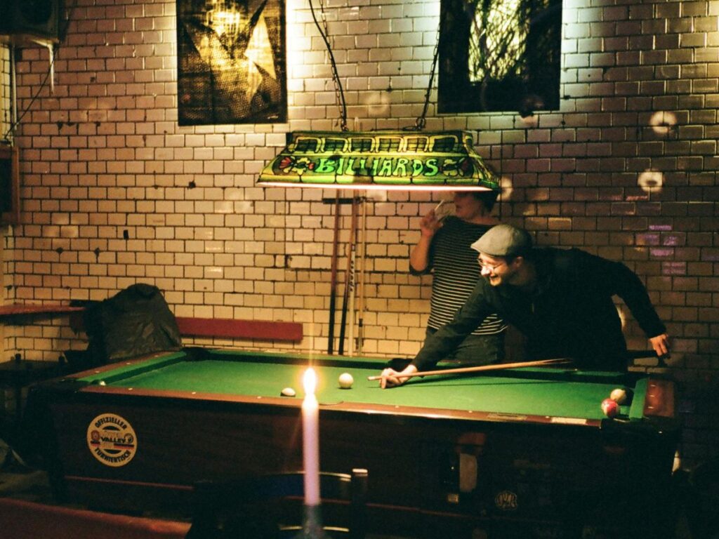 man playing billiards