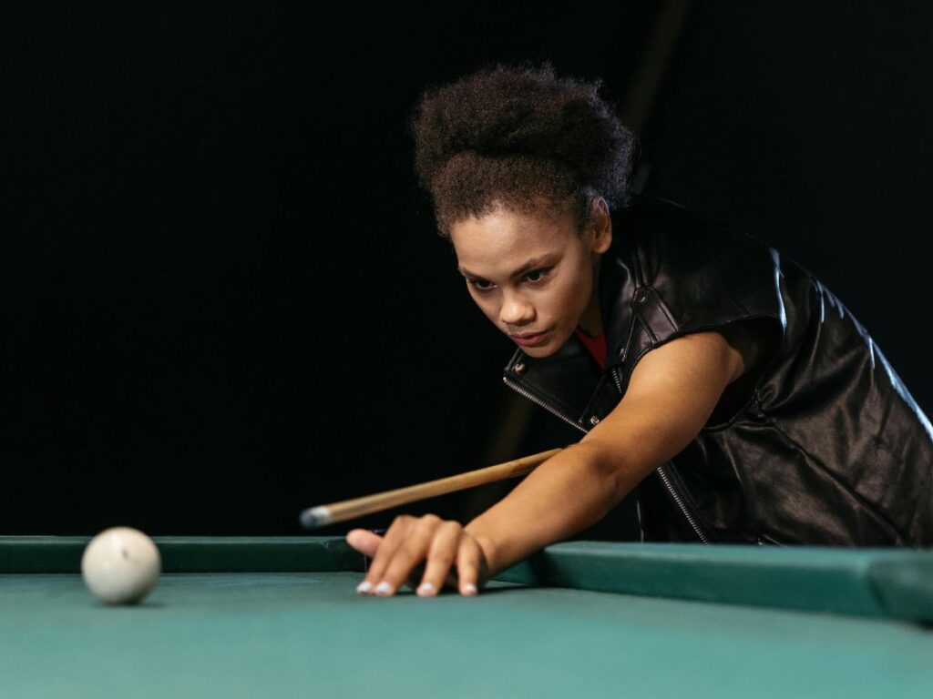 woman playing billiards