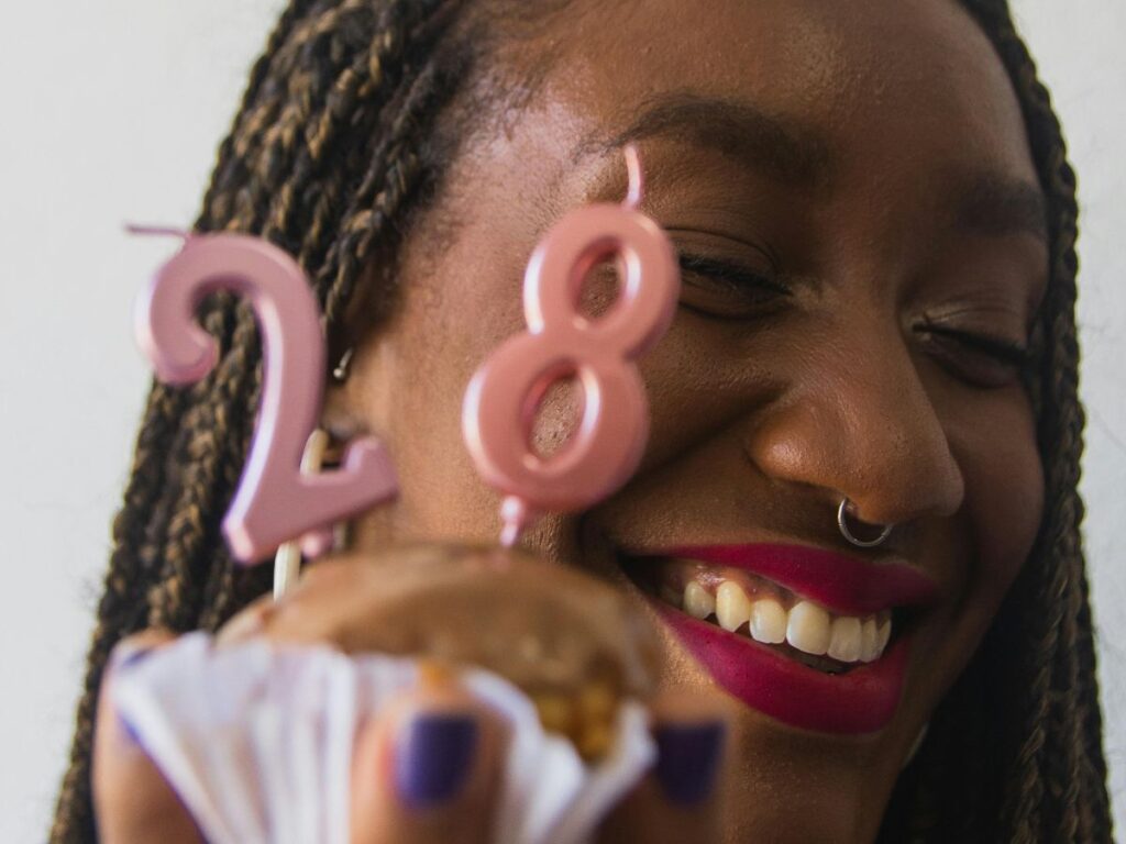 woman holding a cupcake