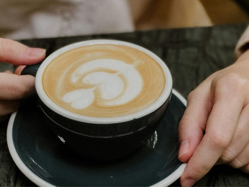 man holding a cup of coffee