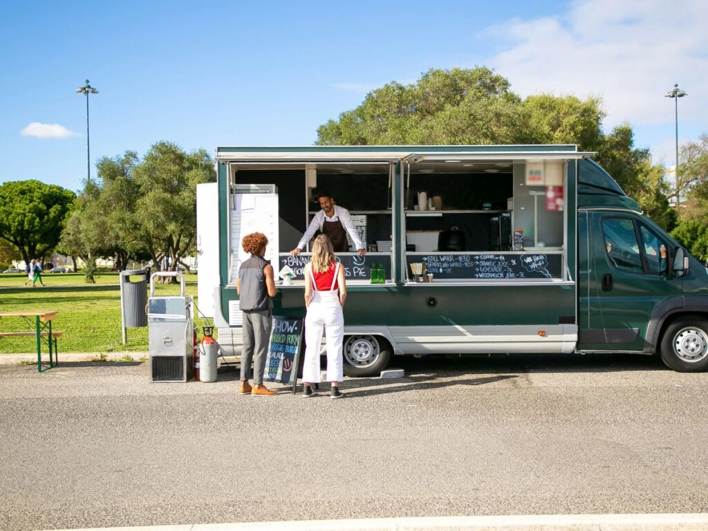 people buying from a food truck