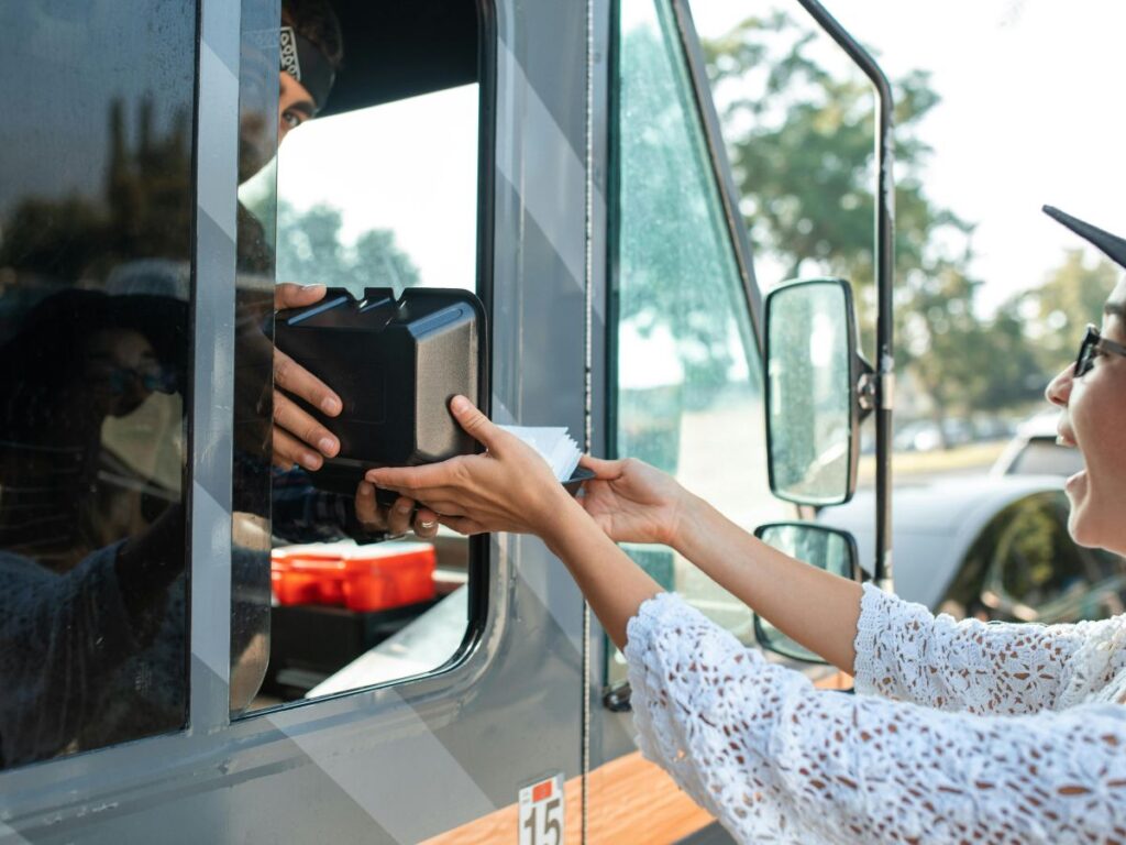 woman buying from a food truck