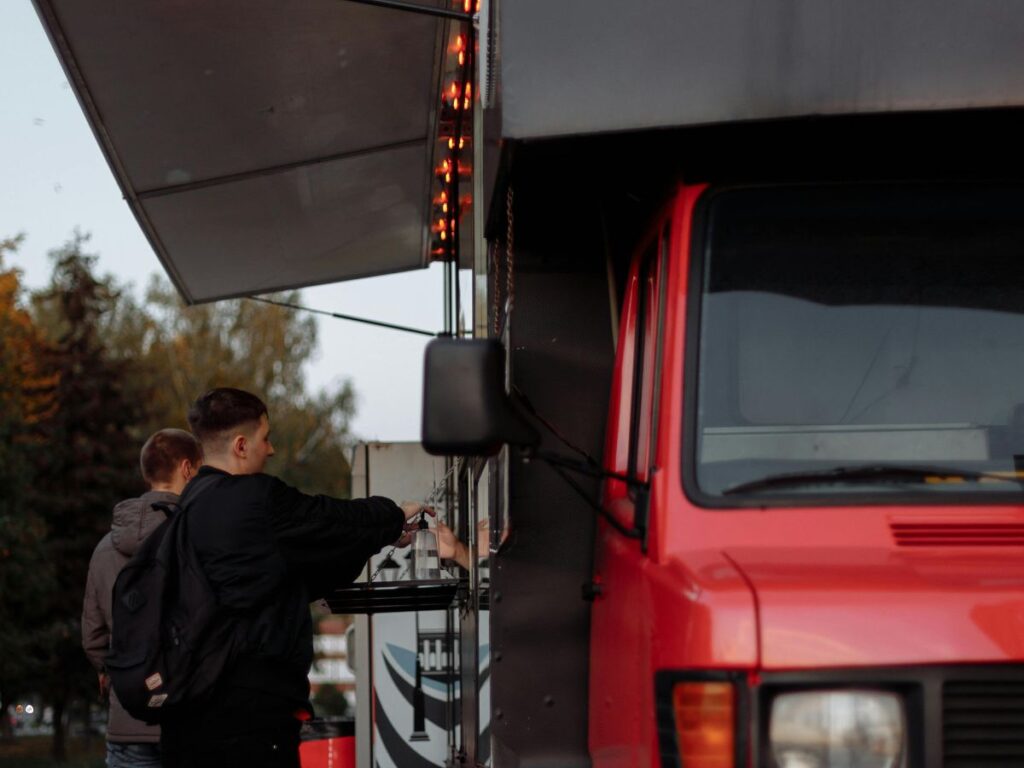 man buying from a food truck