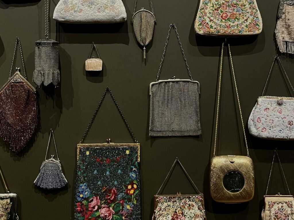 handbags hung on a wall