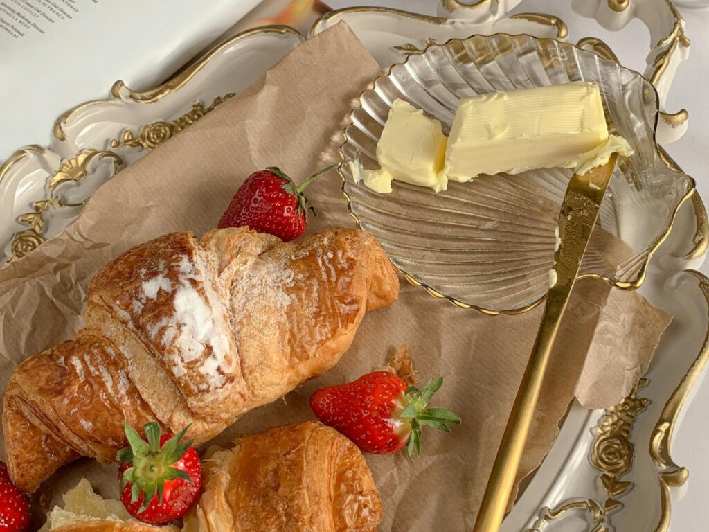 croissant with butter and strawberries