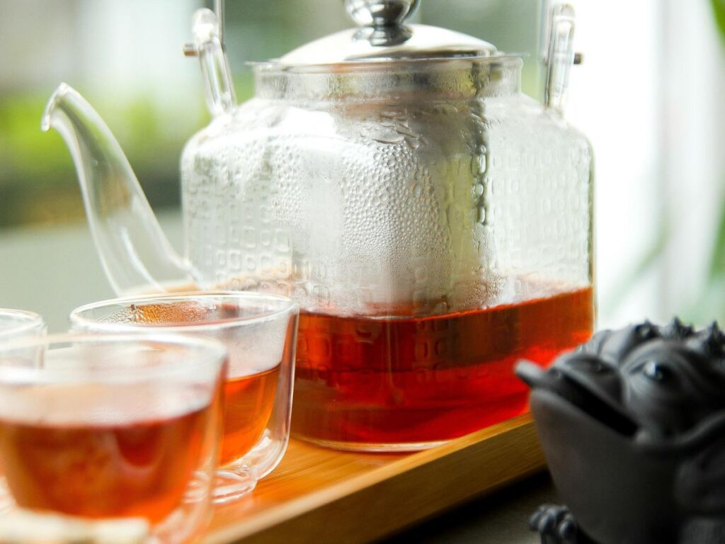 tea in cups and kettle