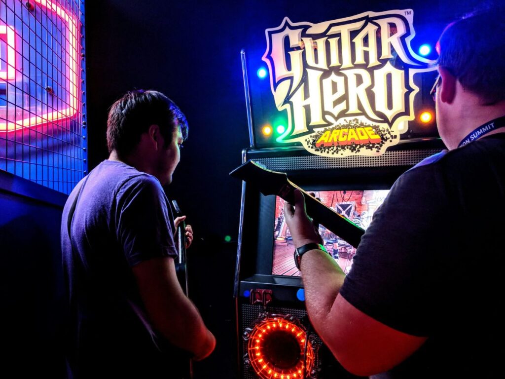 men playing games in an arcade bar