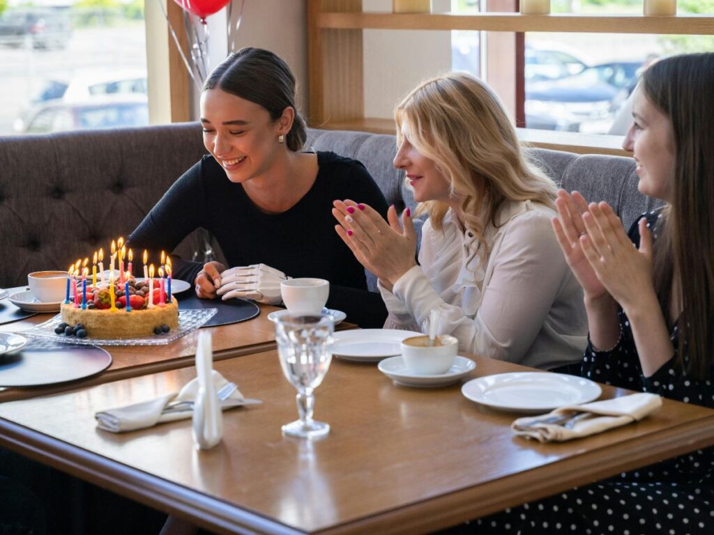 girls celebrating birthday in a restaurant