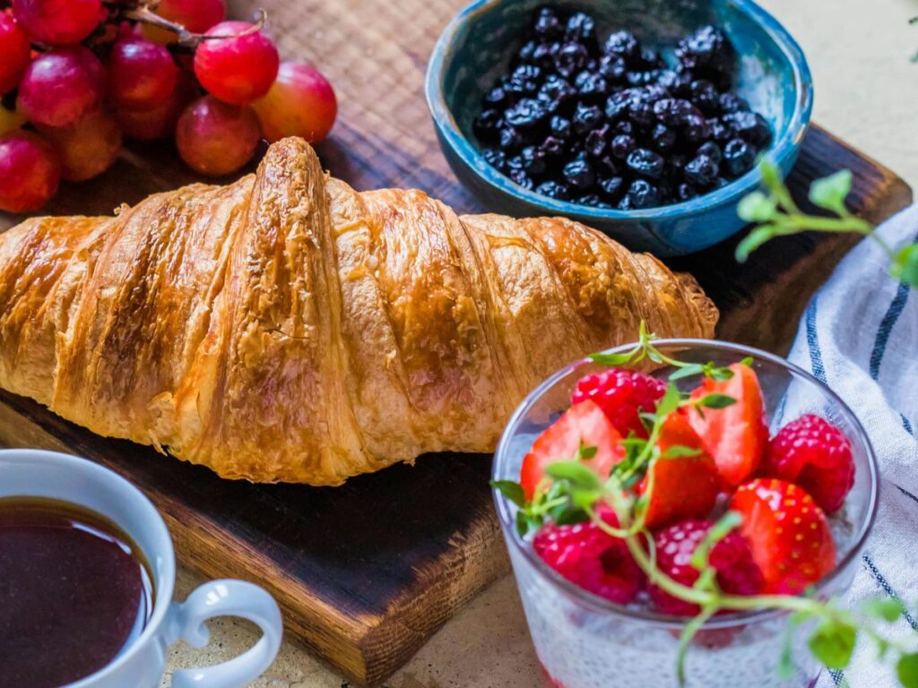 croissant with blue berries and strawberry