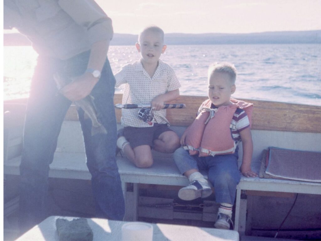 kids boating with their dad