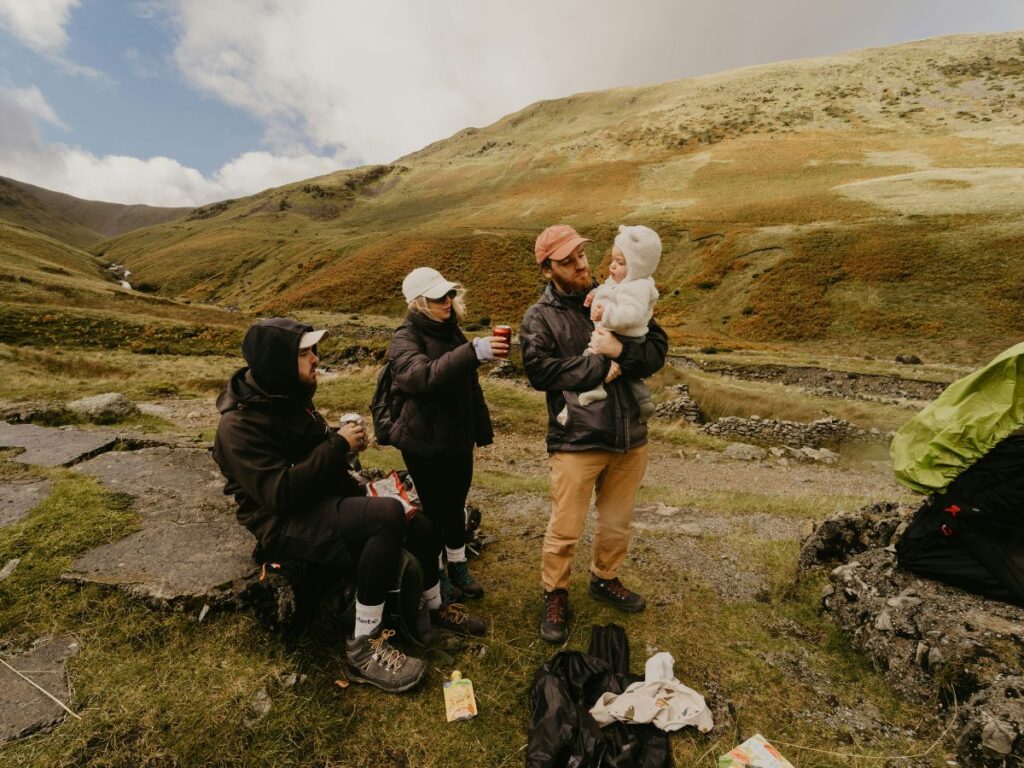 group of people with baby in the mountains