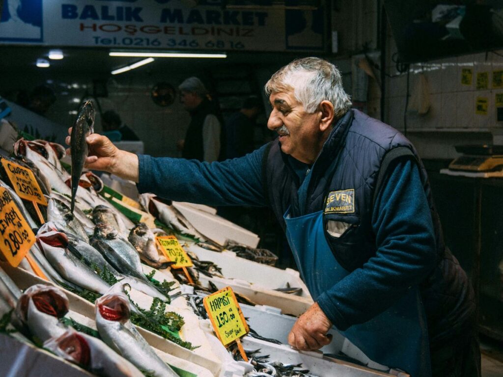 fishmonger in his shop