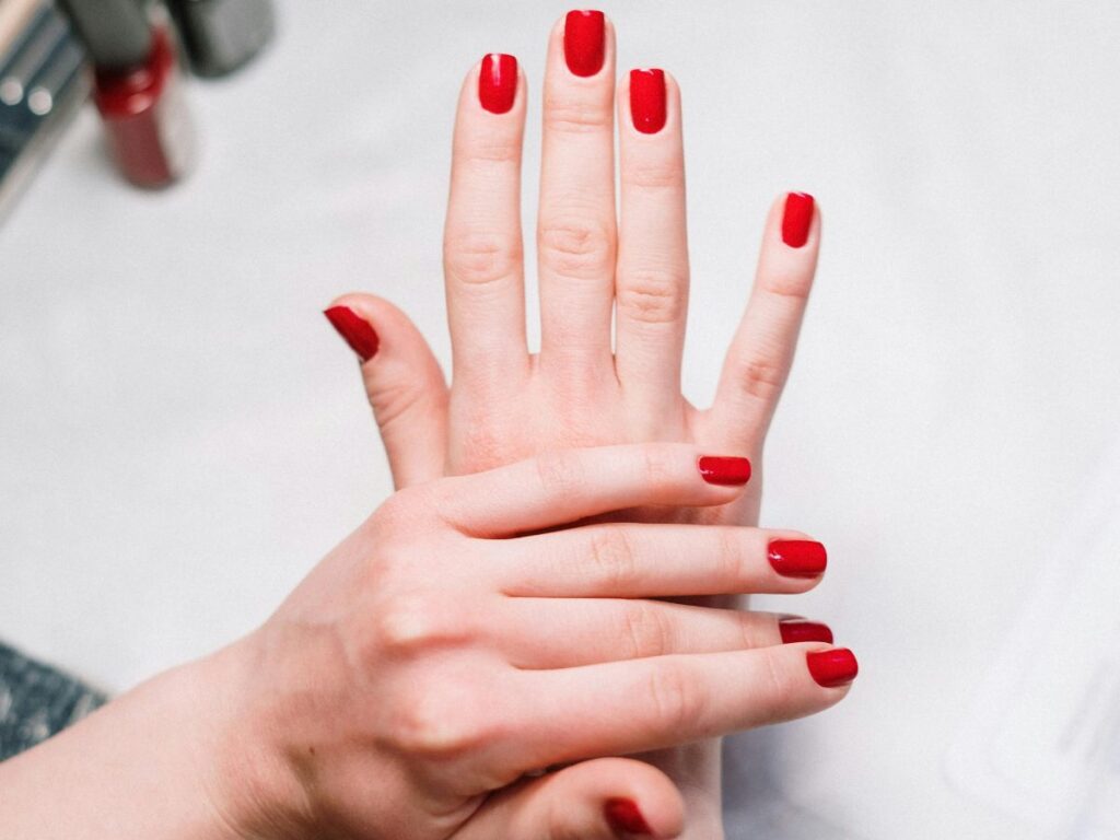 red nailpolish on hands