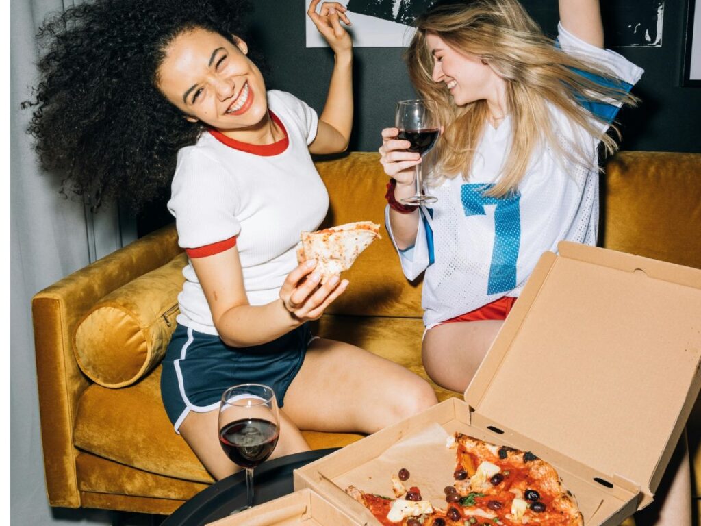 girls enjoying pizza