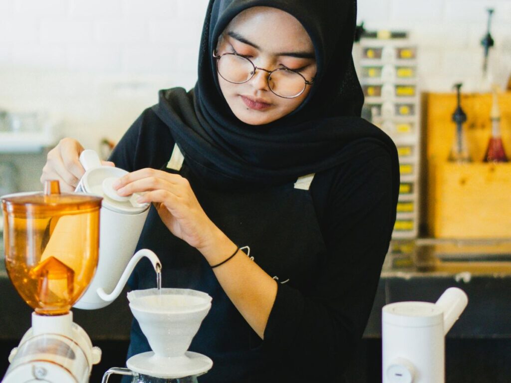 barista brewing coffee