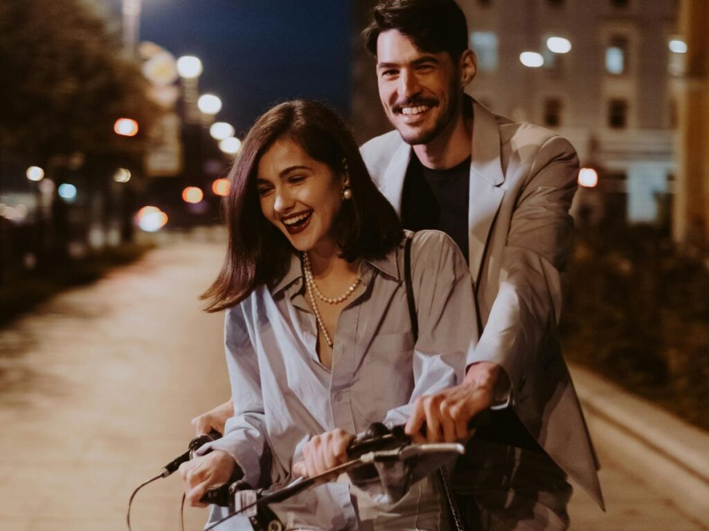 couple riding a bike together