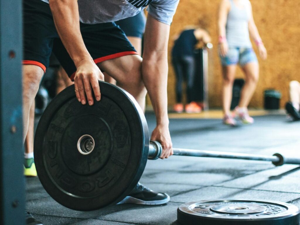 man putting in weights