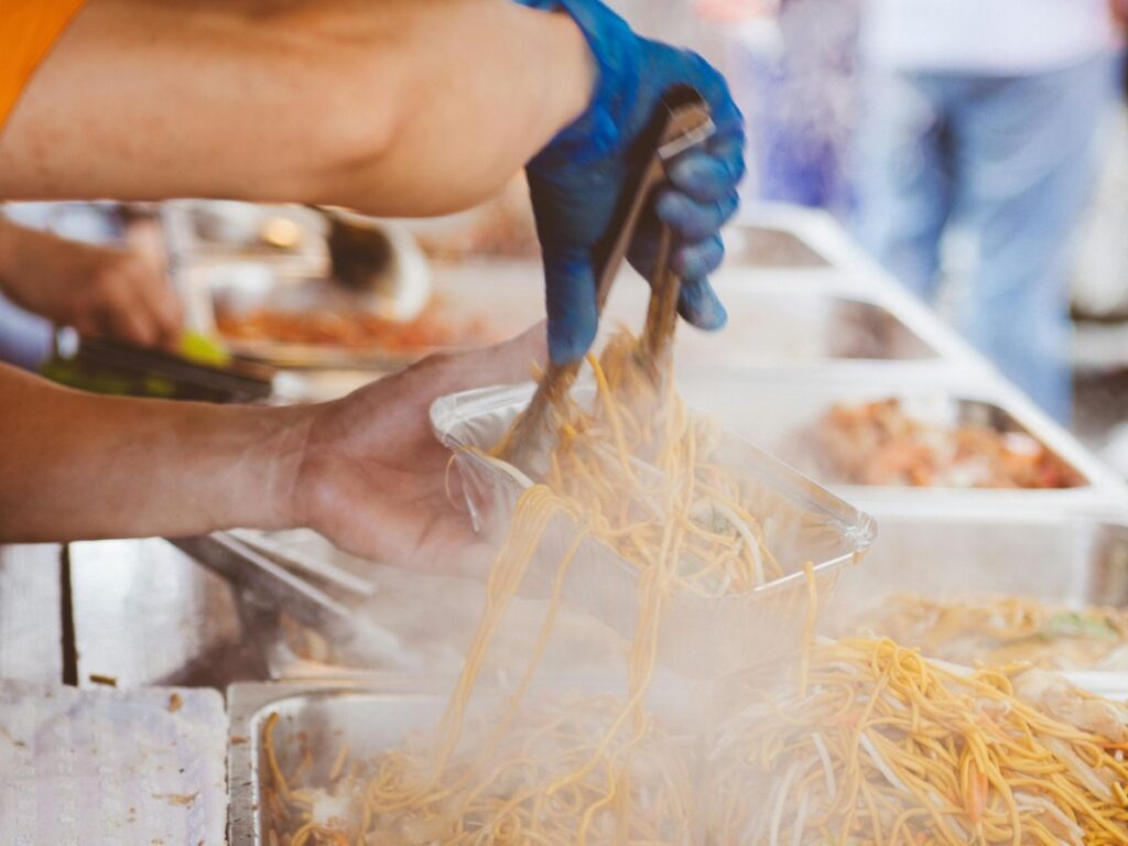 chef plating food at a festival