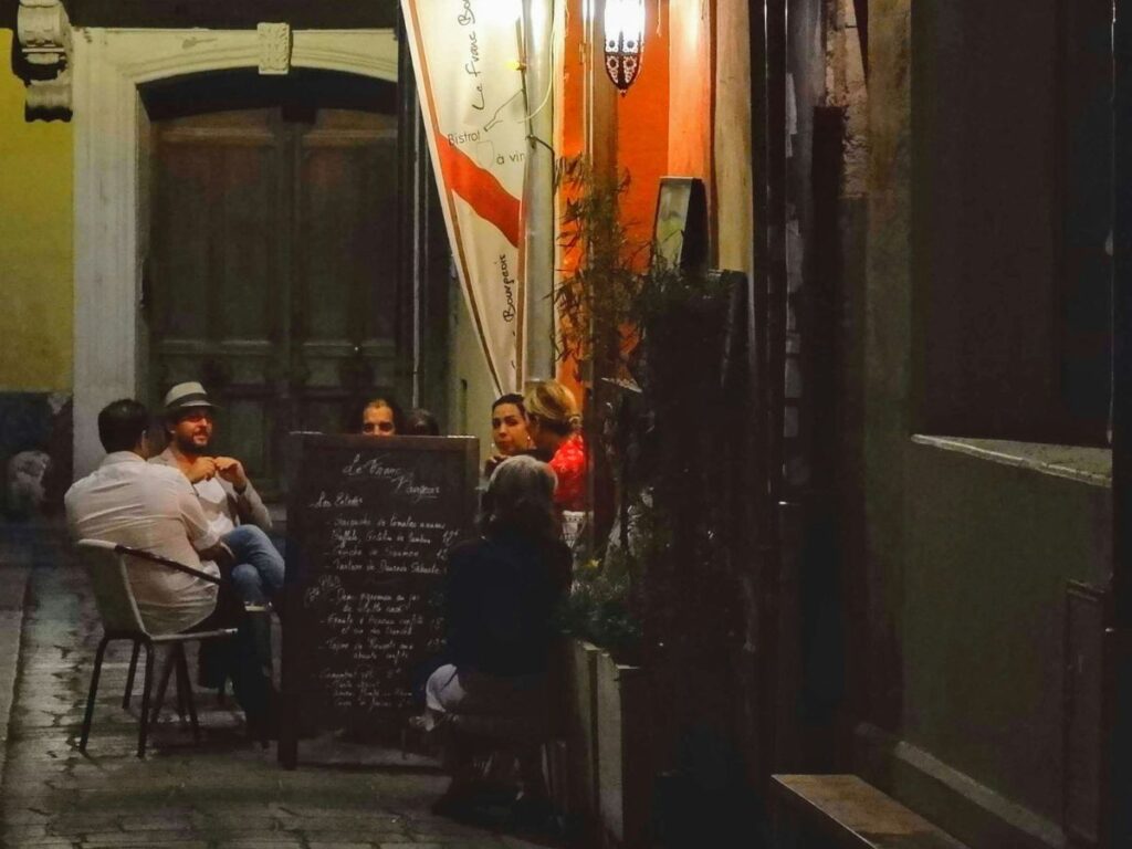 people sitting in an outdoor restaurant