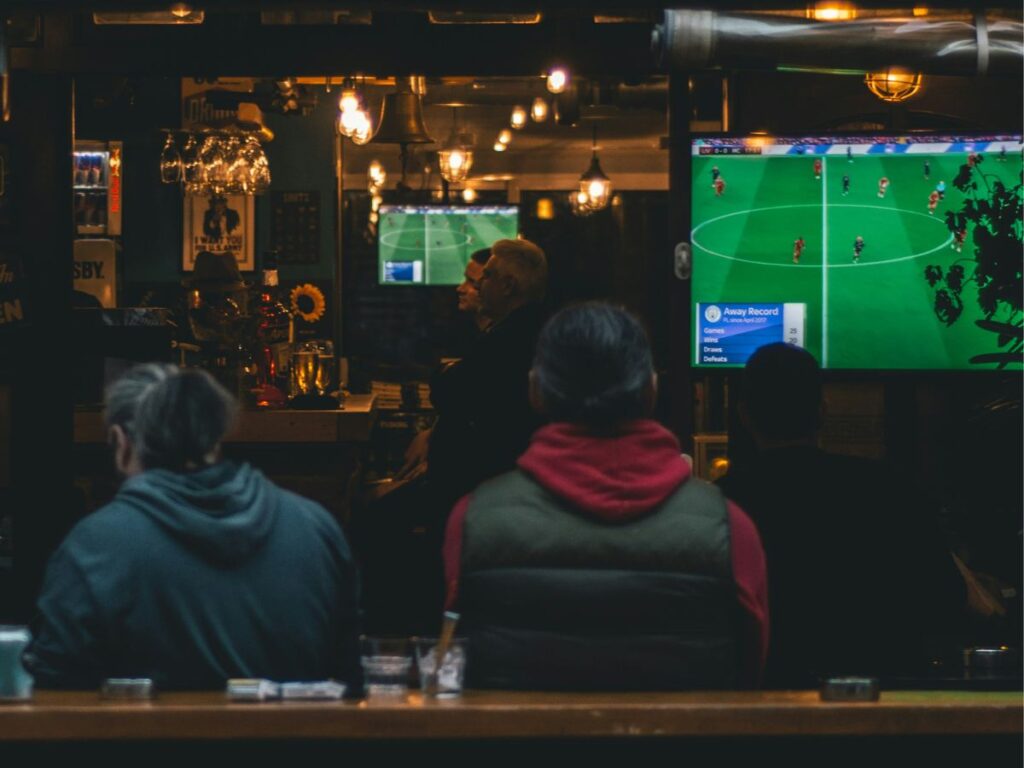 people watching sports in a restaurant