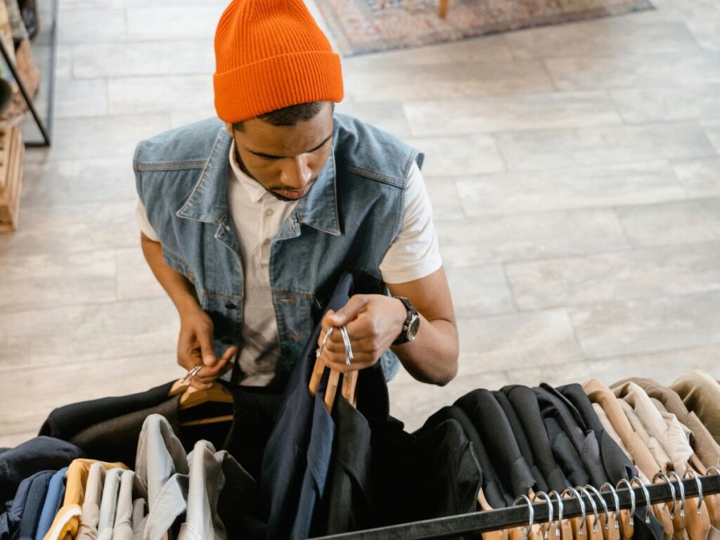 man picking out clothes