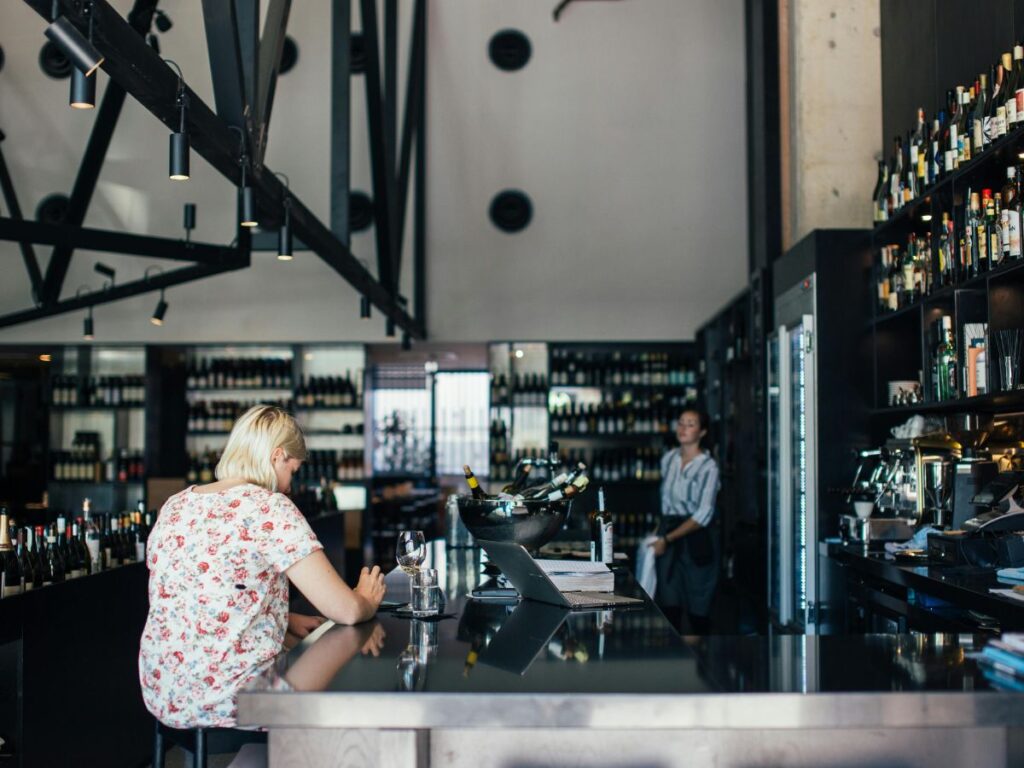 woman sitting at bar