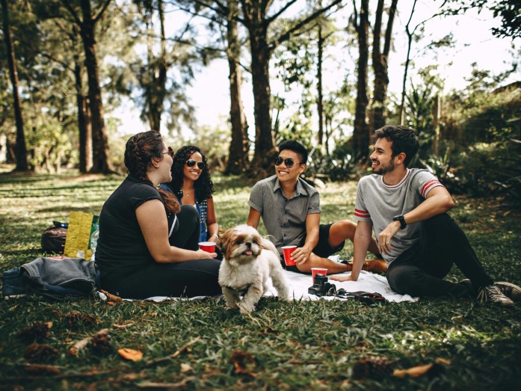 group of people with dog in a park