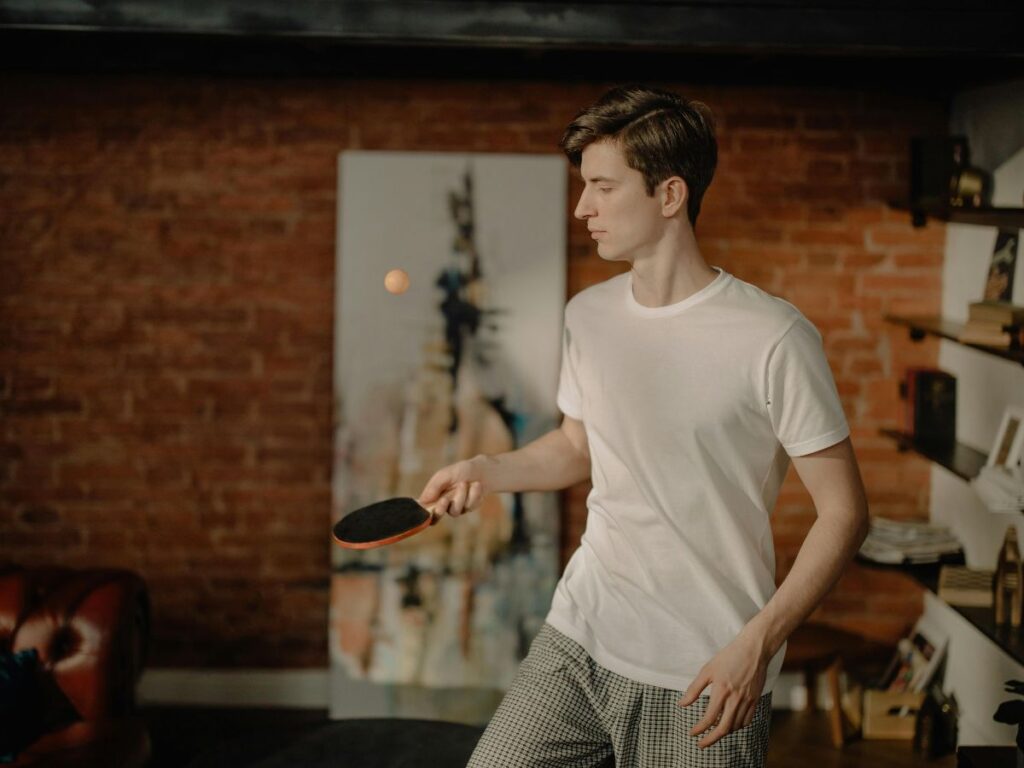 man playing ping pong