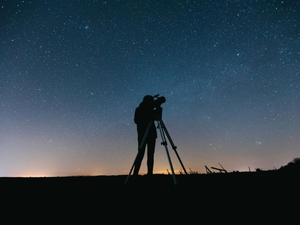 man taking picture of stars