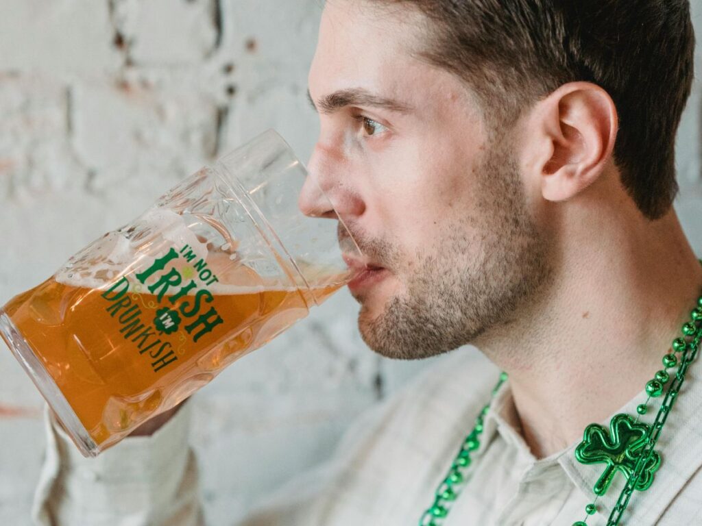 man drinking beer on St. Patrick Day