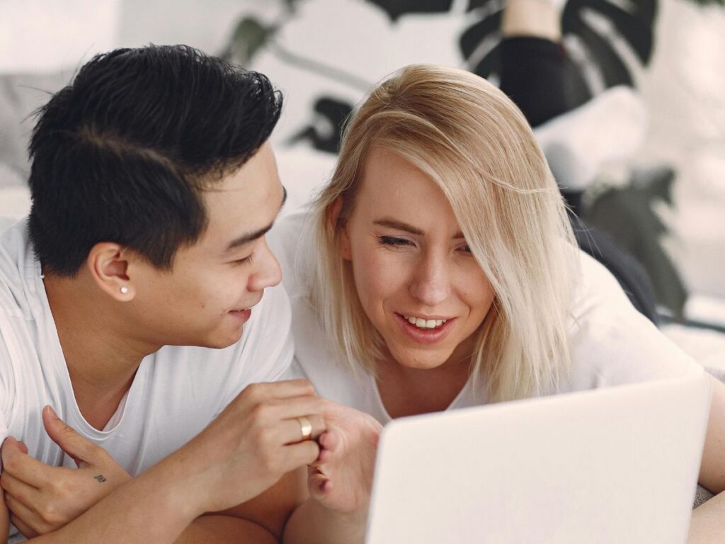 couple watching something on laptop