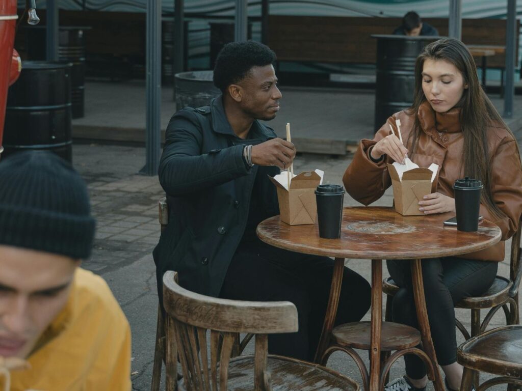 couple eating in a food court