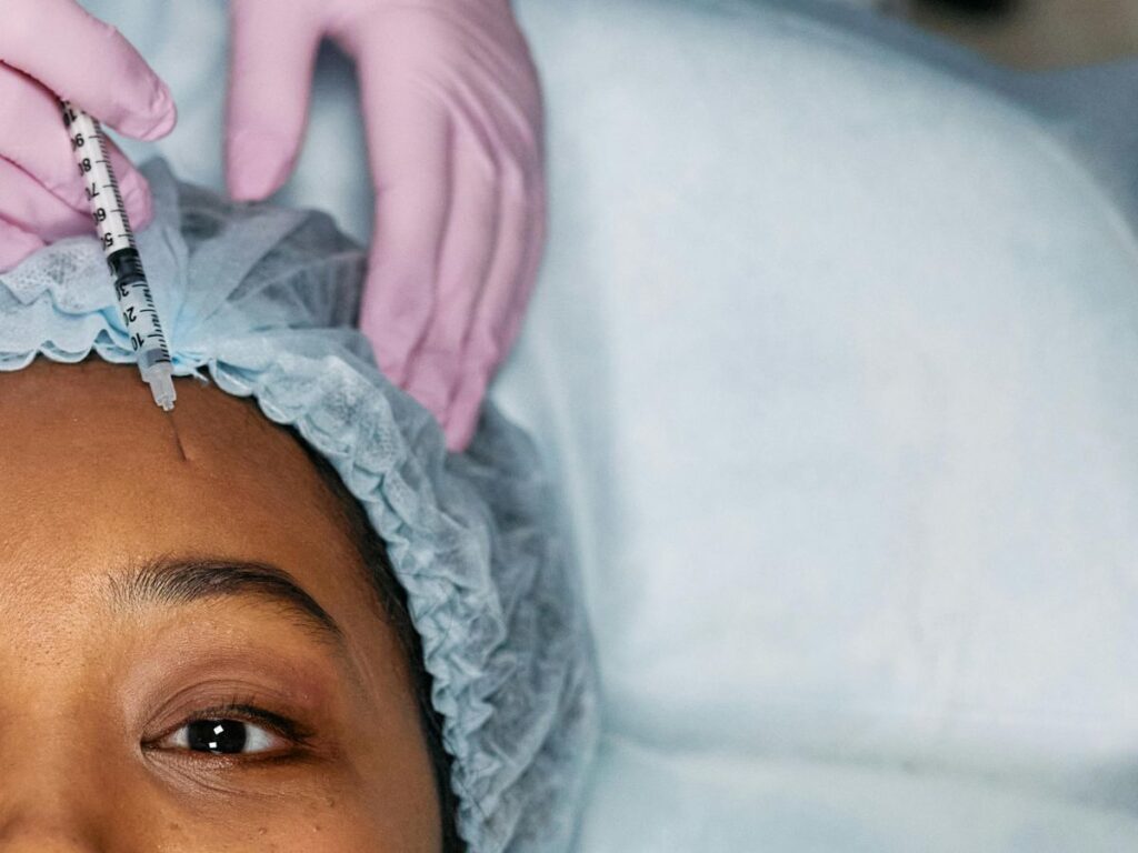 woman getting hair transplant injection