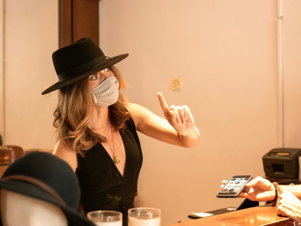 woman wearing a hat in a hat store