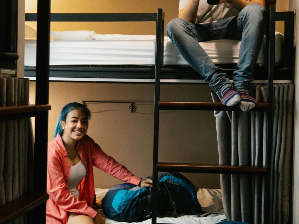 girl and boy in a hostel bed