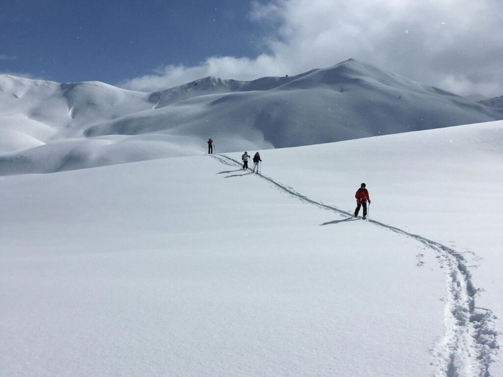 people on a ski trail