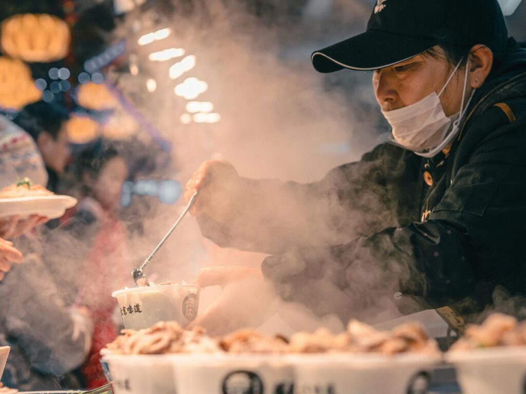 man cooking street food