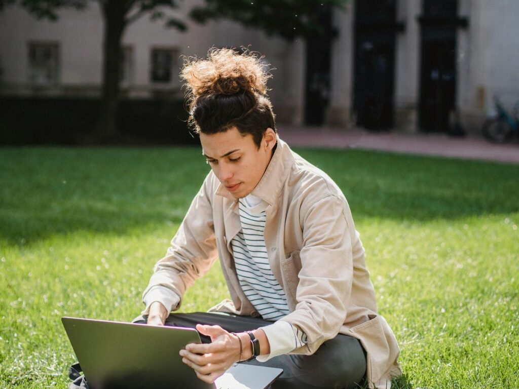 man sitting in university ground