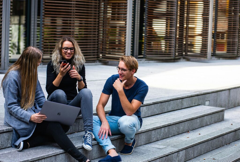 students sitting on university stairs