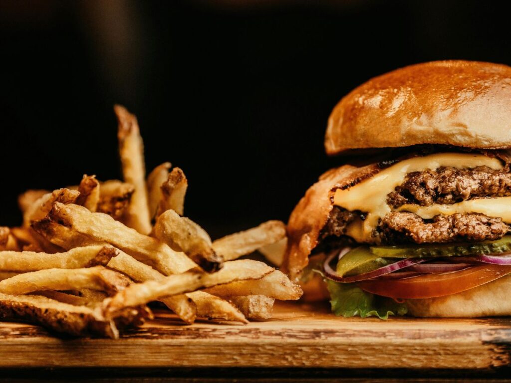 veal burger sandwich with fries