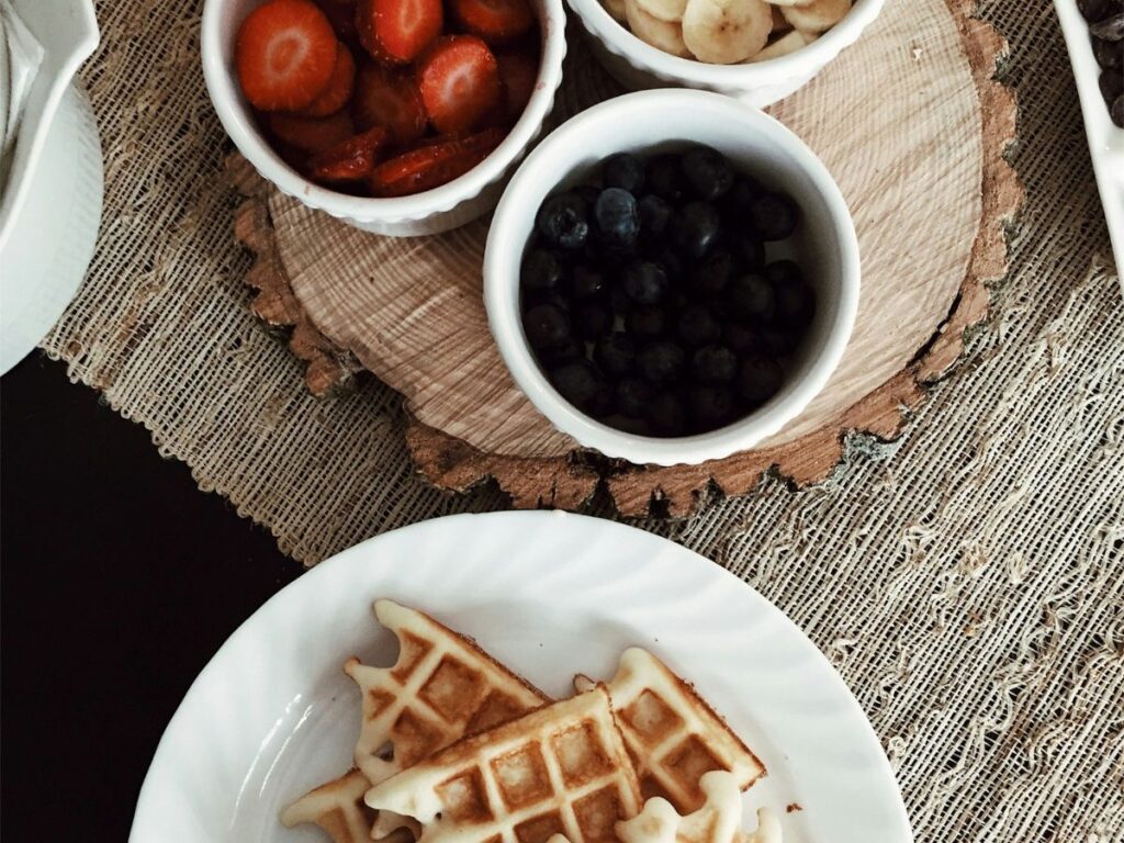 waffles with bananas, strawberries and blackberries