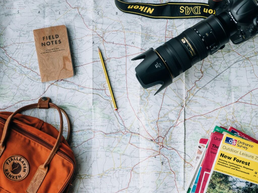 camera and notebook for a trip