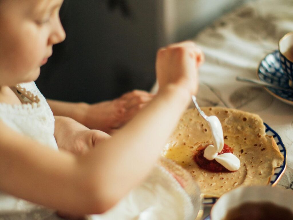 kid making a crepe