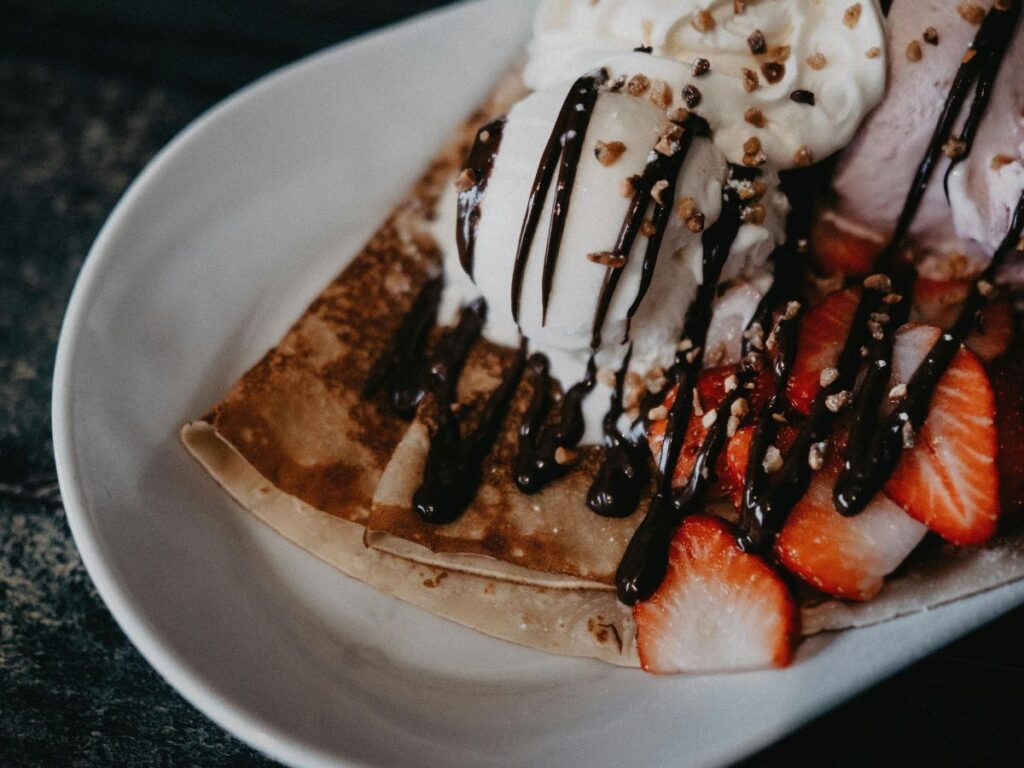 chocolate and strawberry filled crepe with ice cream