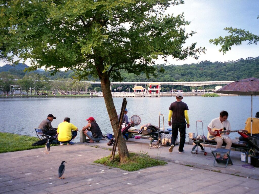 people by the lake